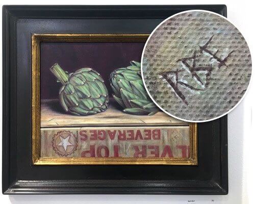 “Artichokes on a Crate” by Brent Erickson, signed with the artist’s initials in a trompe l’oeil style, fitting in with the rest of the painting. (Courtesy of The Art League)