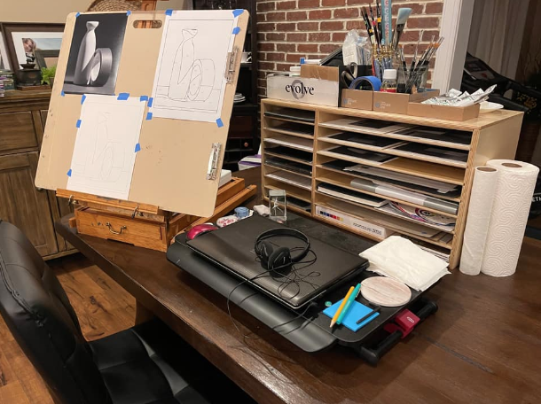 Evolve Student, Leslie uses a box easel in her home studio to save on space 
